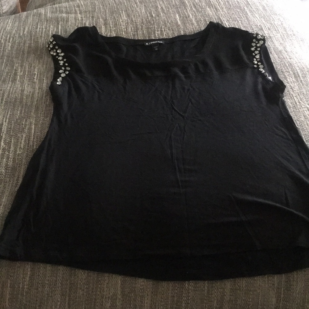 Black shirt with detailed sleeves.